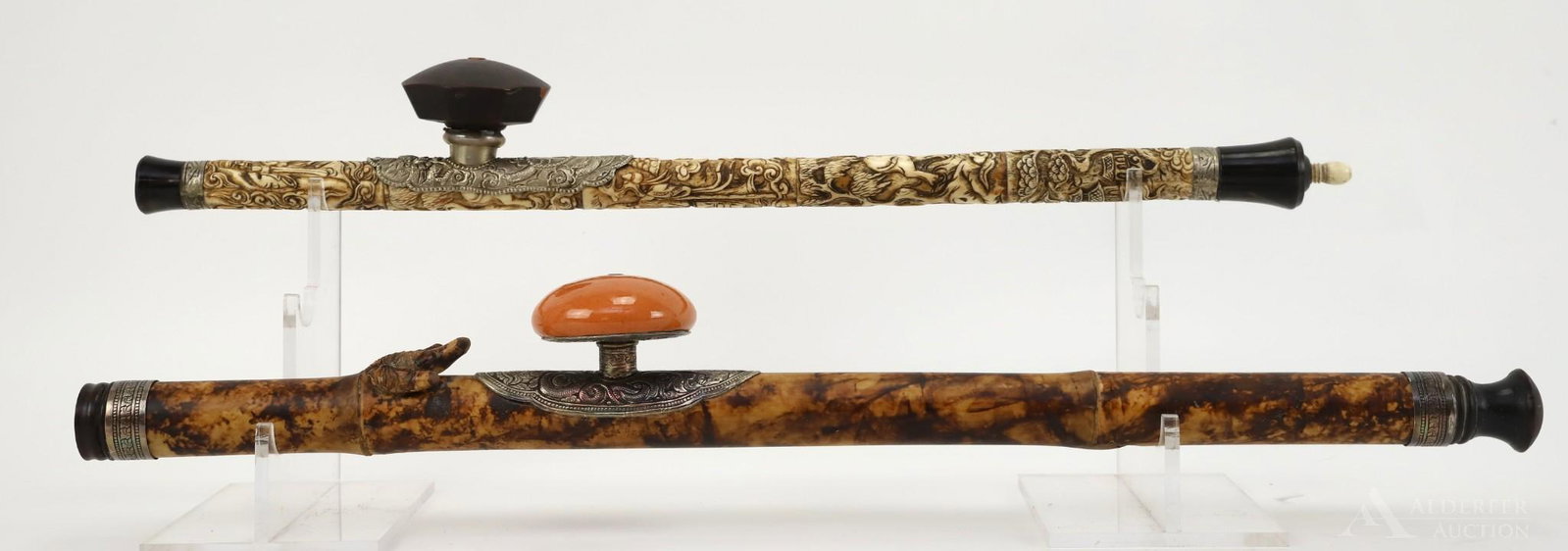 Pair of Opium Bone and Wood Opium Pipes: Relief genre carving on 5-part bone pipe with silver fittings on both ends and elm bowl with character markings attached to decorated plate. 22" length. ??Bamboo stem with three-talon animal claw deco