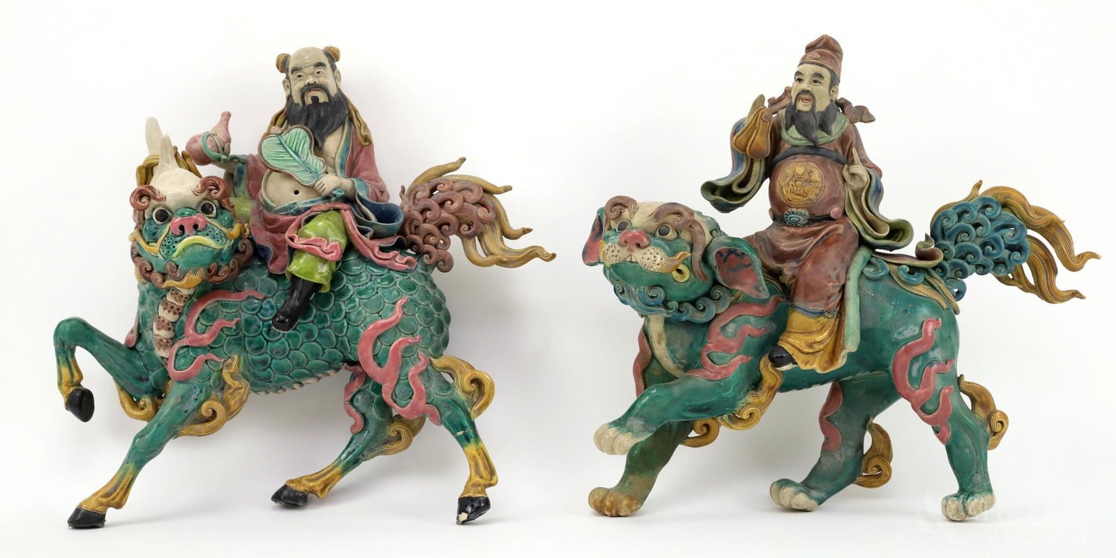 Chinese Ceramic Roof Tile Guardians: Complementing pair of terracotta Guardian tiles with a riders on a Chi Lin and the other a ShiShi. Both signed. 13"h x 14"w and 12.5"h x 14"w