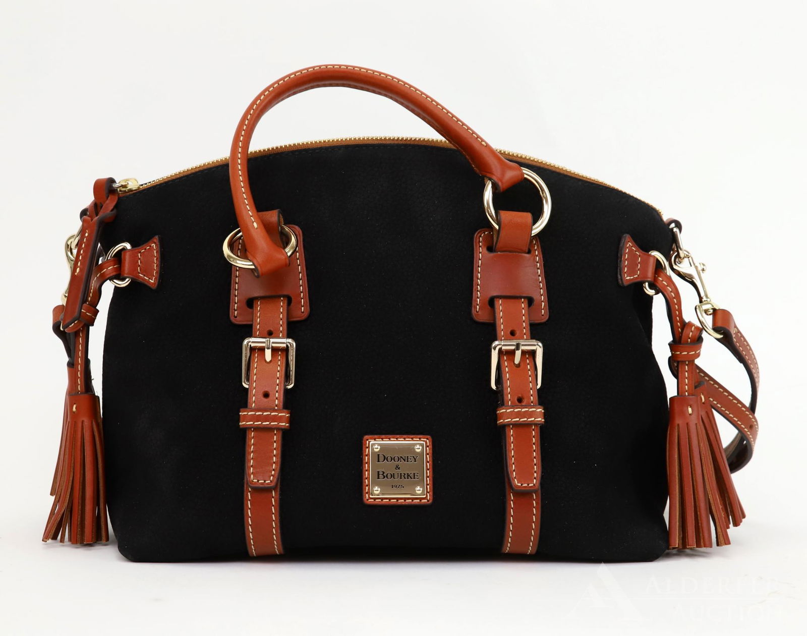 Dooney & Bourke Suede Satchel: Dooney & Bourke Double Strap Tassel satchel in black pebble grain suede with tan trim and red interior. New with original tag. 9"h x 12"w x 6.5"d
