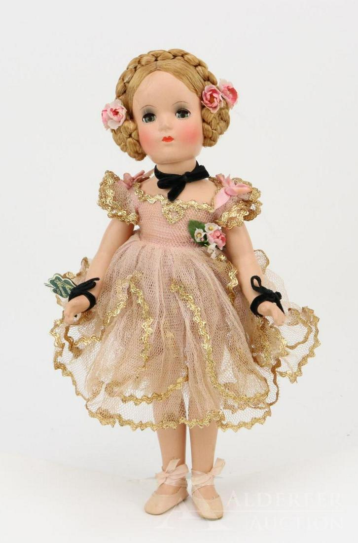 14" TAGGED COMPOSITION 1946 MADAME ALEXANDER: All original (Karen?) doll in unplayed with condition. Margaret face with blue sleep eyes, very pretty coloring. Beautiful honey blonde floss wig with braid on top of head and coiled braids over ears.