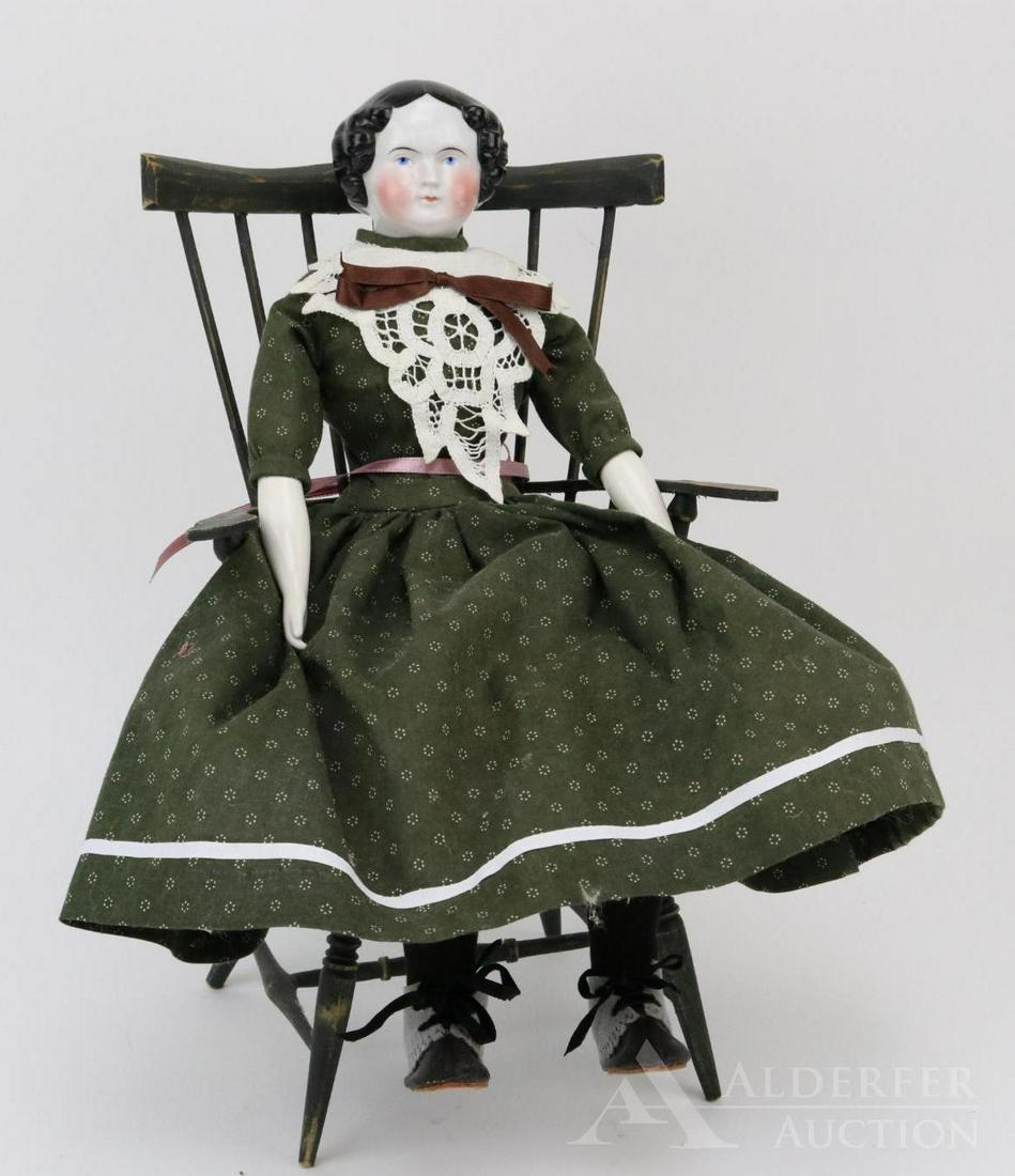 LOT OF CHINA, PARIAN DOLL(S).: 19" Unmarked antique china shoulder head doll with black center part hair, blue eyes. Nice cheek coloring. Older cloth body with reproduction china lower arms. Dressed in newer dress, vintage underwea