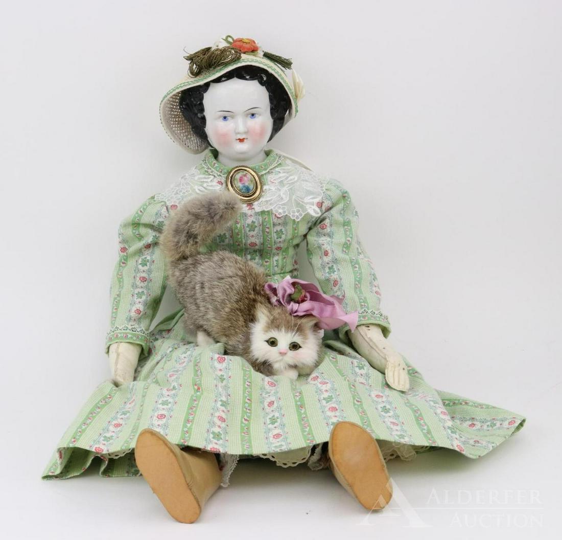 LOT OF CHINA, PARIAN DOLL(S).: Lot. 27" Unmarked antique china shoulder head doll with center part black hair, blue eyes, paler cheek coloring. Older cloth body with white leather lower arms, sewn down fingers. Dressed in newer 2 p