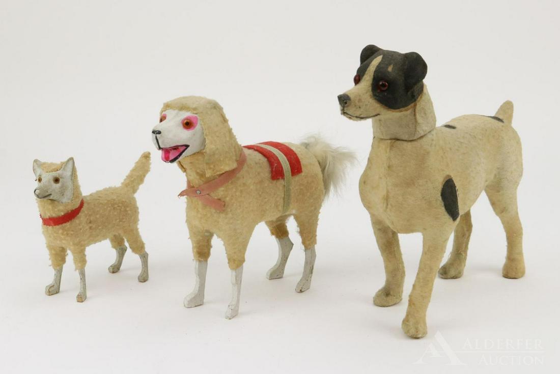 LOT OF HOLIDAY/NOVELTY.: Lot of (3) unmarked papier mache dogs inc. a CANDY CONTAINER. All of the dogs are wrapped in wool cloth, have glass eyes. 7 1/2" T. candy container. Condition: cylinder going into neck has been repair