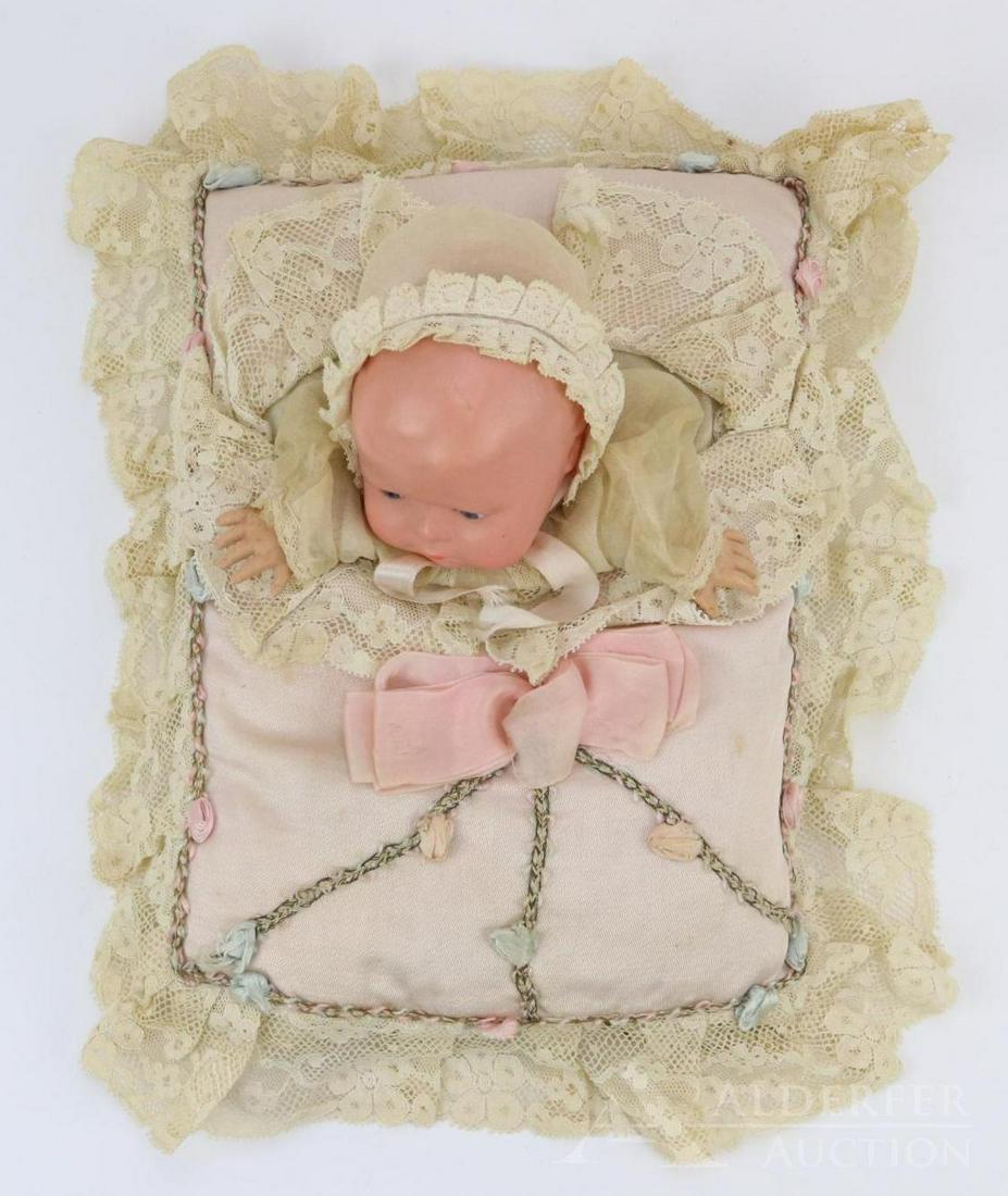 LOT OF HOLIDAY/NOVELTY.: All original Turtle Mark 102/14 Celluloid baby hand puppet on pillow. Overall measurement of pillow is 8" x 11" with lace ruffle. Solid dome head is 10" cir. with stationary eyes. Celluloid hands. Con