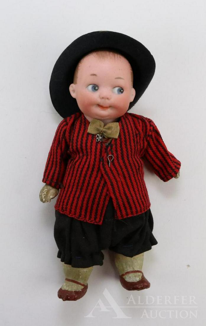 ANTIQUE BISQUE HEAD DOLL(S), 12" AND UNDER.: 6 1/2" 320 A.11/0.M Googly Eye character doll with solid dome head. Painted features and hair. Integliio eyes, watermelon smile. 5 Pc. papier mache body with painted shoes,, socks. Doll may have been