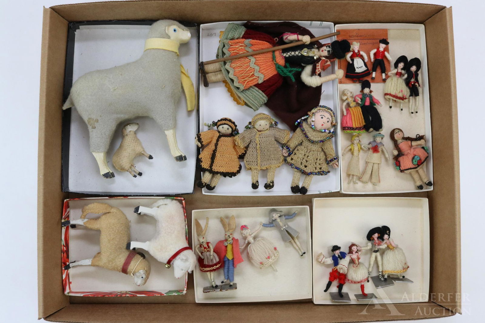 LOT OF MINIATURES/MINI DOLLS.: Lot of mini dolls and sheep. Dolls - 2" wrapped couples (Hungary). 2". (2) 2" Wrapped rabbits. 6 1/2" Portugal. (3) Crocheted with painted faces. Sheep - 2", 3", 3 1/2", 6". Condition: some age discol