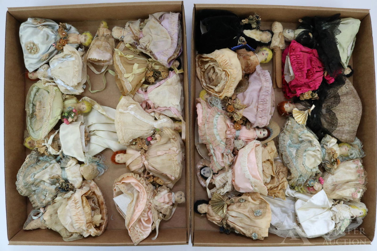 LOT OF MINIATURES/MINI DOLLS.: Lot of (25) 1930's? clothes pin dolls. There are (2) bridal sets in two different sizes. All of themhave the clothes pin bodies with hand painted padded faces, wool yarn hair. The smaller set is 4" an