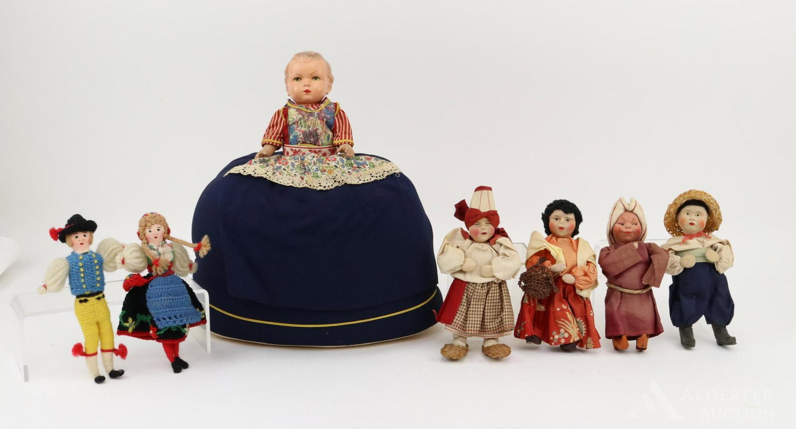DOLL(S) REPRESENTING OTHER COUNTIRES.: Lot of all original cloth dolls. (4) 6"-7" Dolls Made in the Soviet Union. 15" 1940's Dutch Girl "Tea Cozy" with composition head. (Missing hat). (2) 7" Yarn wrapped Scandinavian dolls with embroidere
