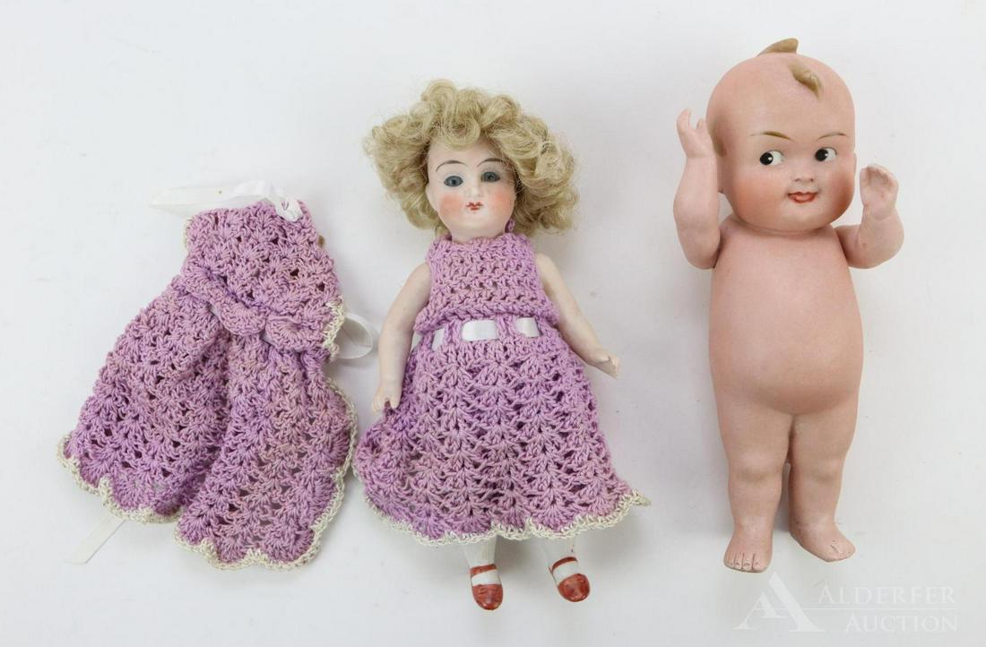 LOT OF ALL BISQUE DOLLS.: Pair of German dolls. 7 1/2" 11529 0 B character doll with painted black side glance eyes. Open/closed mouth with tongue tip sticking out. Molded wisps of hair. Strung arms only. NO clothing. Conditio
