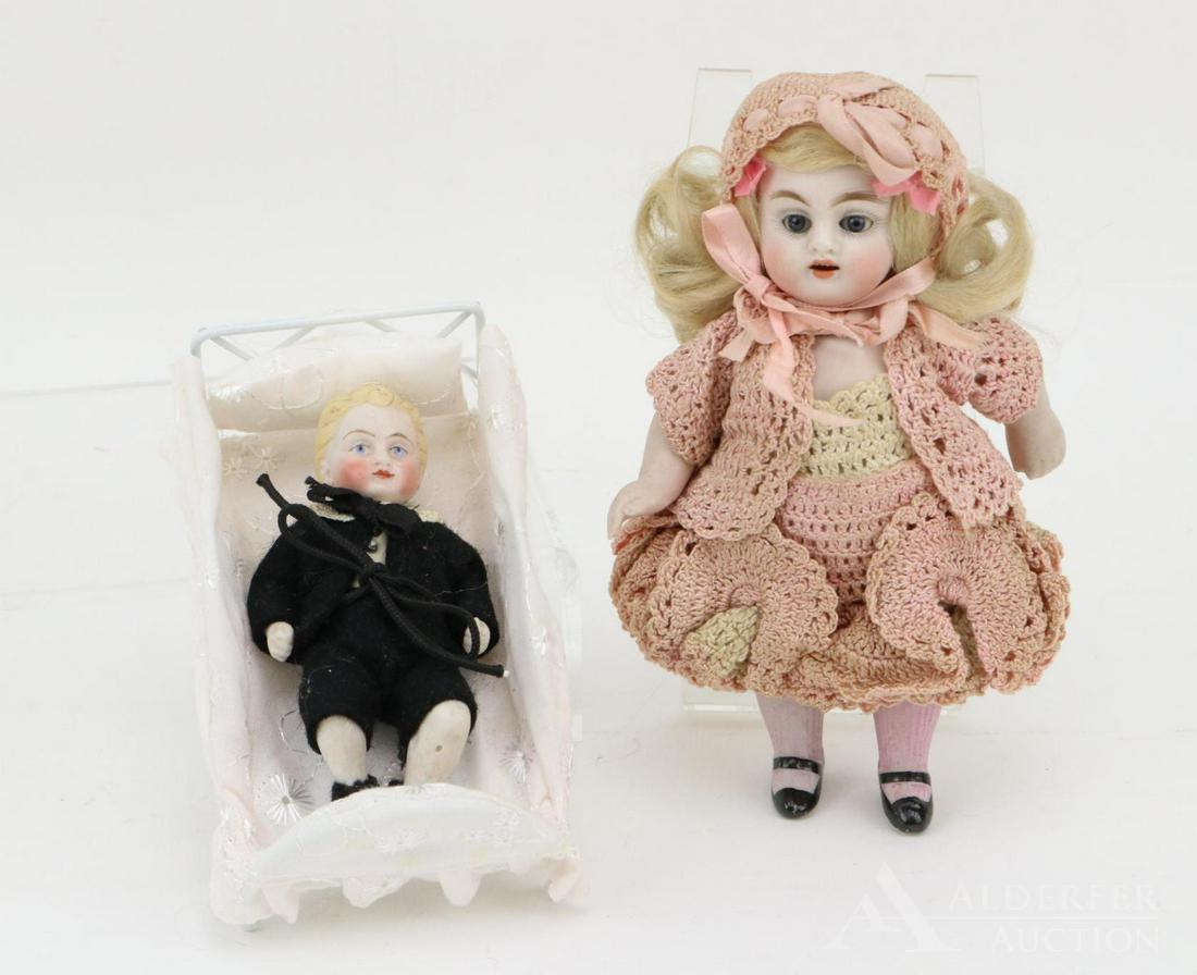 LOT OF ALL BISQUE DOLLS.: Pair of German dolls. 6 1/2" 150 0 Doll with blue sleep eyes. Open mouth, blonde mohair wig, plaster pate. 5 Pc. body with painted black shoes, pink shirred socks. Dressed in crocheted outfit. 4" Chil