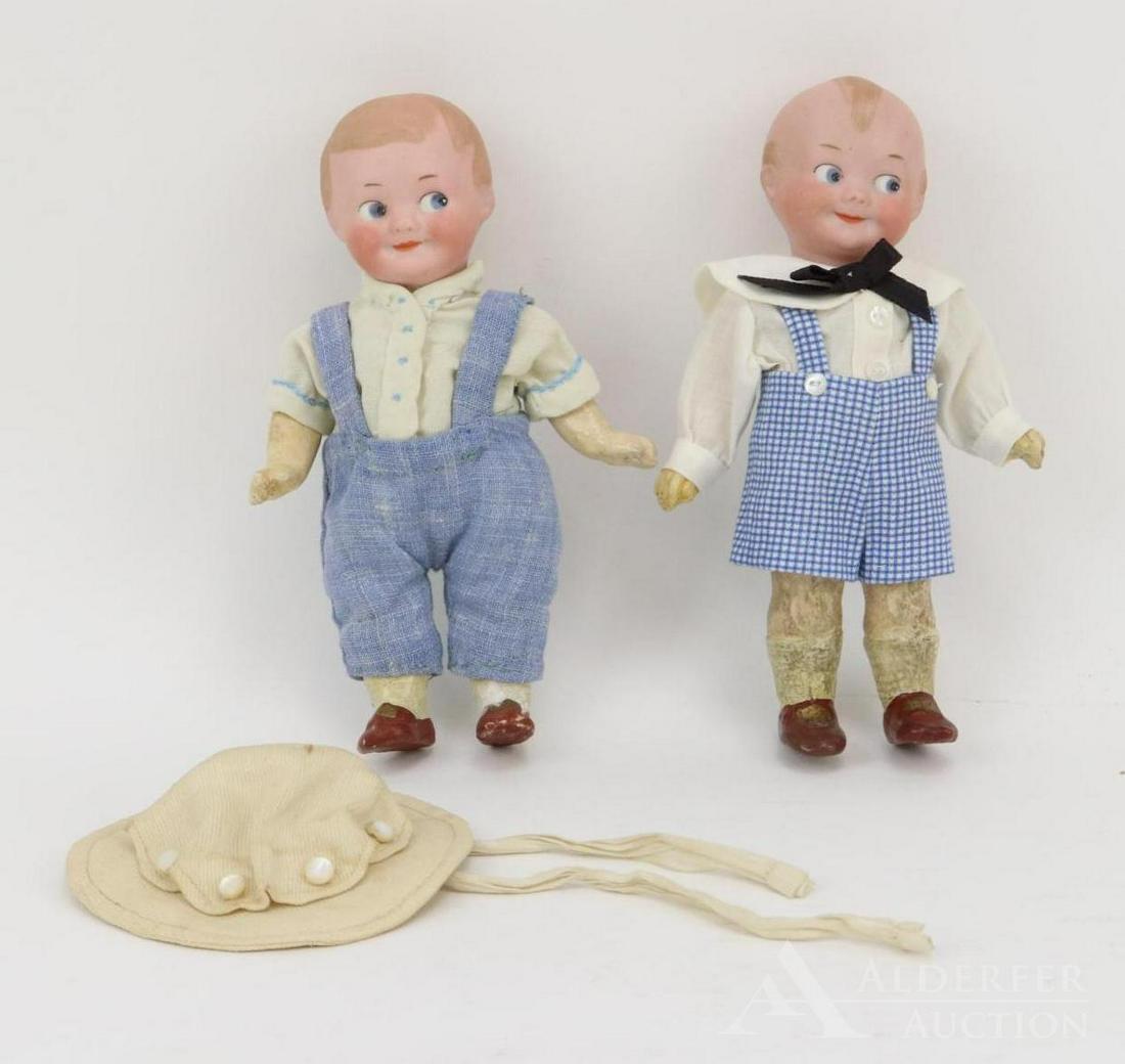 ANTIQUE BISQUE HEAD DOLL(S), 12" AND UNDER.: Pair of GOOGLY eye dolls. Both boy dolls are marked AM and have solid domes, painted features. Blue side glance integlio eyes, watermelon smiles, blonde hair. 5 Pc. papier mache bodies with painted br