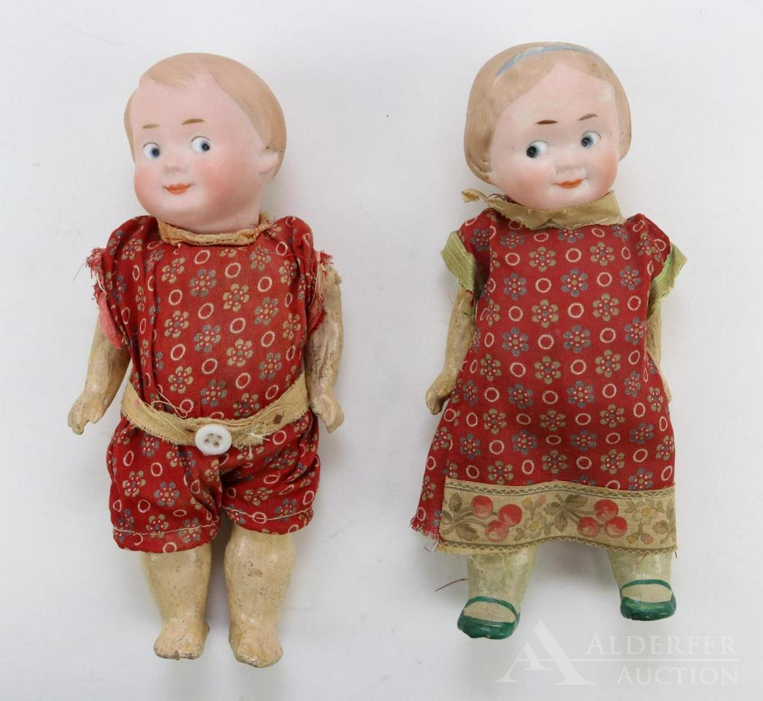 ANTIQUE BISQUE HEAD DOLL(S), 12" AND UNDER.: Pair of GOOGLY eye dolls. Both dolls (girl and boy) are marked R45A and R46A, 11/0. They have solid domes with painted features. Blue side glance integlio eyes, watermelon type smiles, blonde hair. 5 
