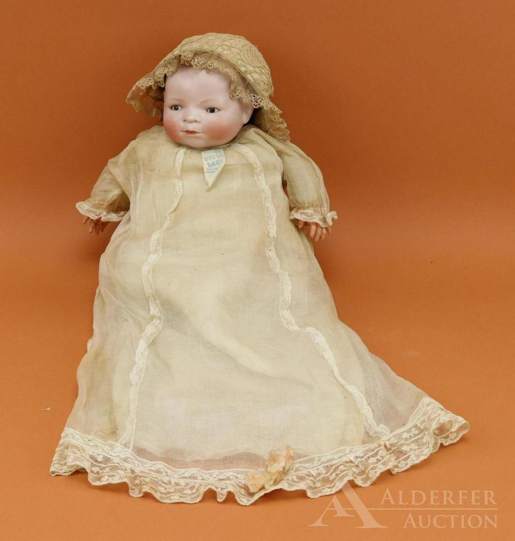 LOT OF GERMAN BISQUE HEAD BABY DOLLS.: 16" L. 14" Cir. "BYE-LO" Baby by Grace Storey Putnam. Brown sleep eyes, painted light brown hair. Original cloth "frog" body with celluloid hands. Dressed in all original tagged K and K BYE-LO BABY go