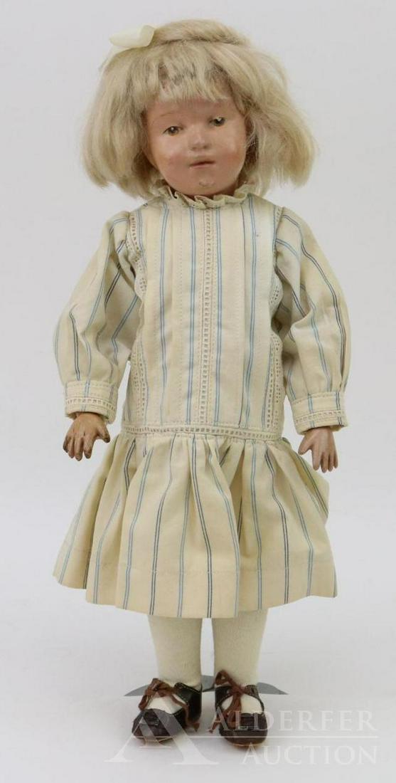 SCHOENHUT LOT.: 14" Model No. 313 doll. Incised mark on back of torso. Replaced blonde mohair wig style #308. Brown integlio eyes. Redressed in copy of an original Schoenhut dress, union suit and brown leather Mary J
