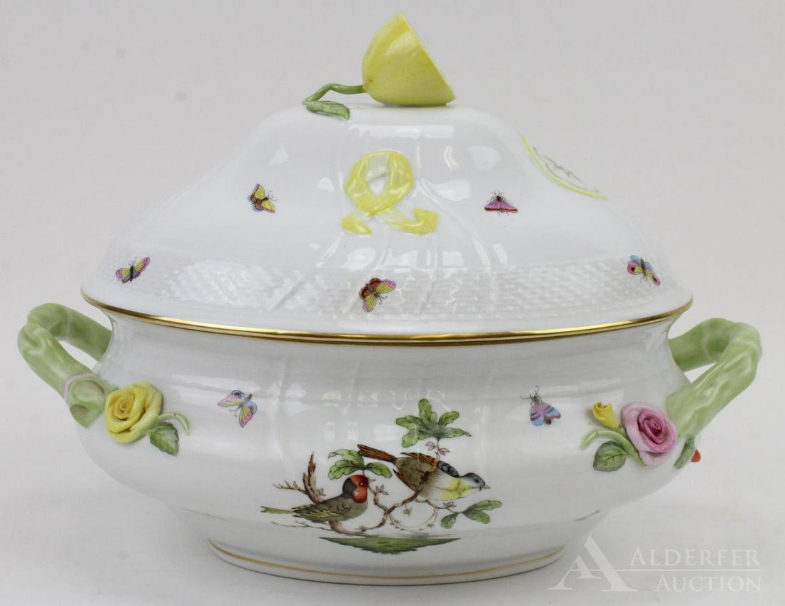 Herend Porcelain Tureen: Herend hand-painted porcelain oval covered tureen in the Rothschild Bird pattern with lemon finial and flowers in relief, #1003. Entire piece with lid measures 13.5" length x 11" height.