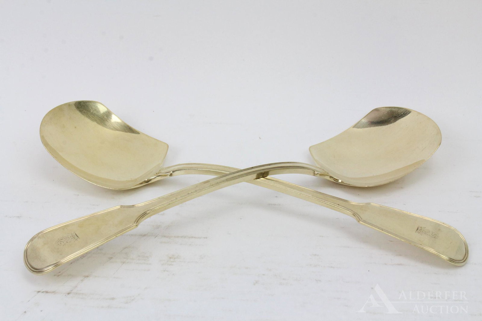 George III Sterling Silver Serving Pieces: pair of vermeil serving spoons with squared bowls, London 1820 by William Eley and WIlliam Fearn. 10.25"l and 9.8ozt