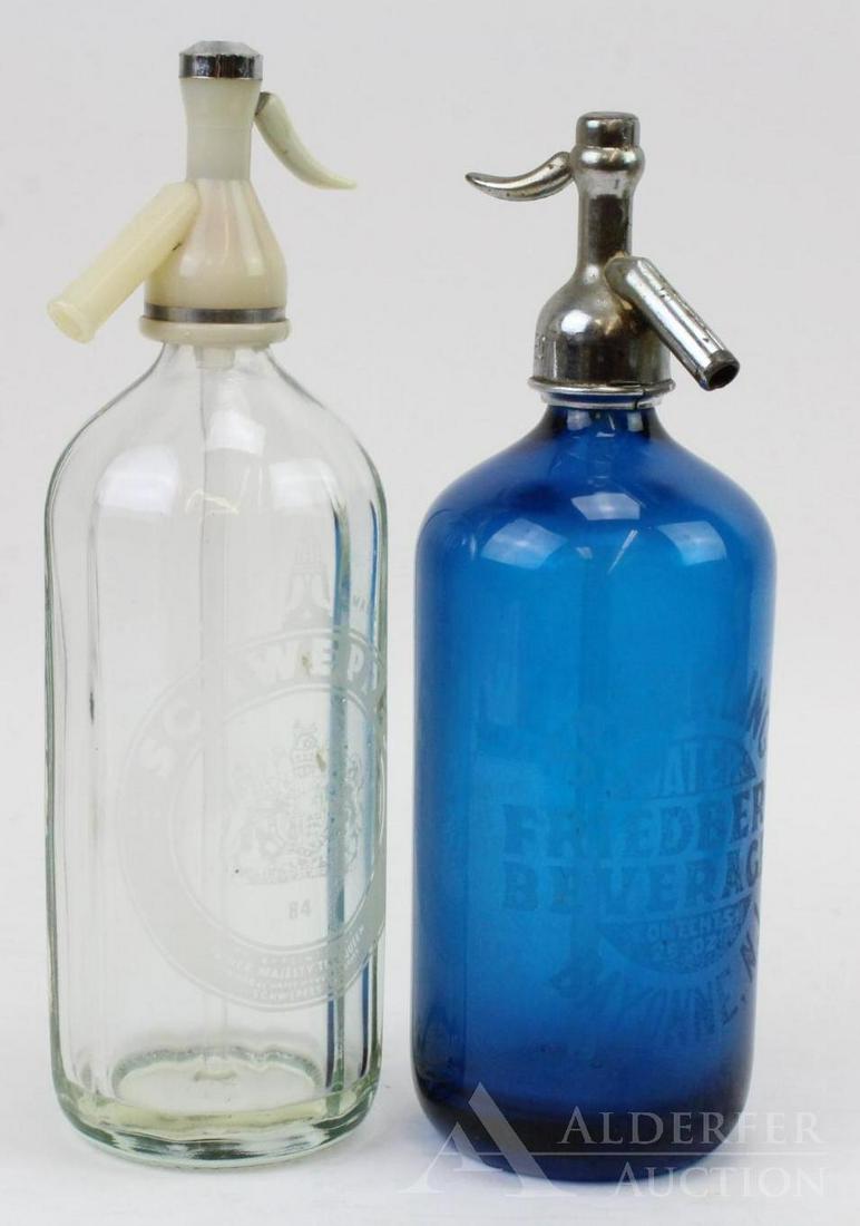 Seltzer Bottles: Grouping of (2) seltzer bottles with siphon tops. Includes blue Friedberg Beverage bottle from Bayonne, NJ and Schweppes paneled glass bottle with bakelite top. Large item 12" h.