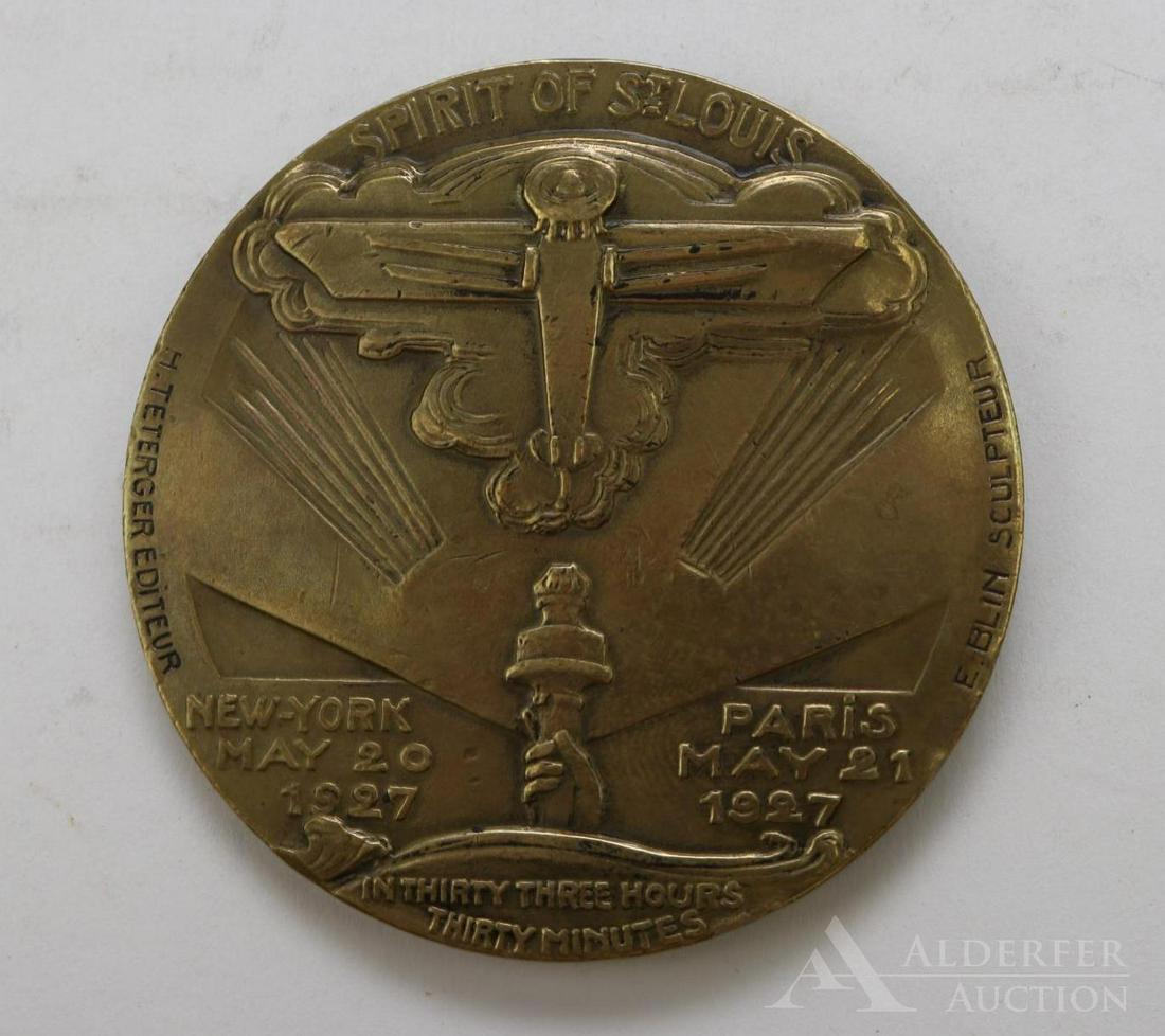 Charles A. Lindbergh Medal: Designed by E. Blin and inscribed Charles A Lindberg. E Blin 153. Spirit of St. Louis. New York May 20, 1927. Paris May 21, 1927. In thirty three hours thirty minutes. H Teterger, editeur. E Blin, s