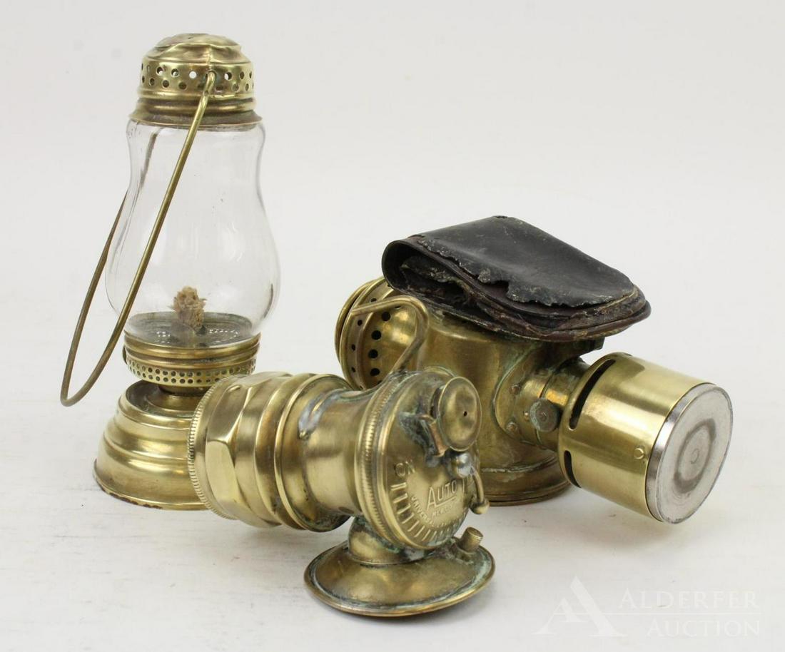 Brass Lamp Grouping: Grouping includes a brass handled kerosene lamp (top is dented), an Autolite carbide mining lamp (Universal Lamp Co., Chicago) and a Neverout insulated kerosene safety light (Rose Mfg., Philadelphia