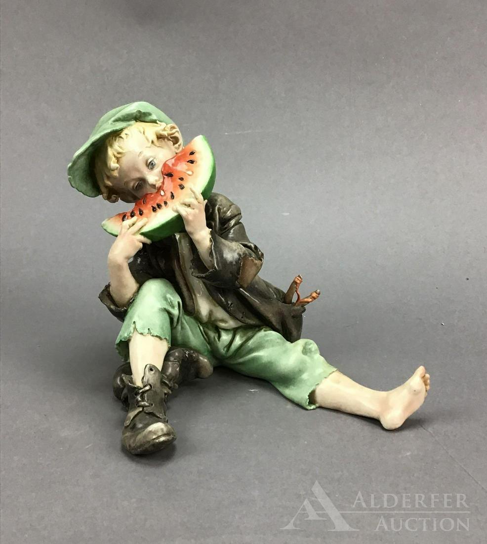Cappe Porcelain Figure: Italian porcelain figure of boy eating watermelon, by Bruno Giuseppe Cappe, measuring 6.5”h. Capodimante mark.