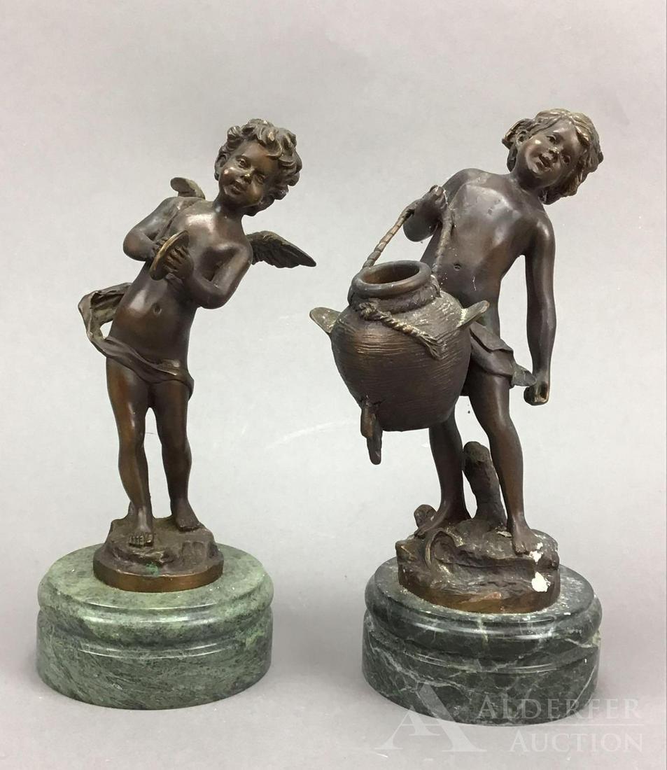 Auguste Moreau Bronzes: Pair of complementing bronzes of a young boy with a water jug and a cherub. Both on marble plinths. 10.25”h