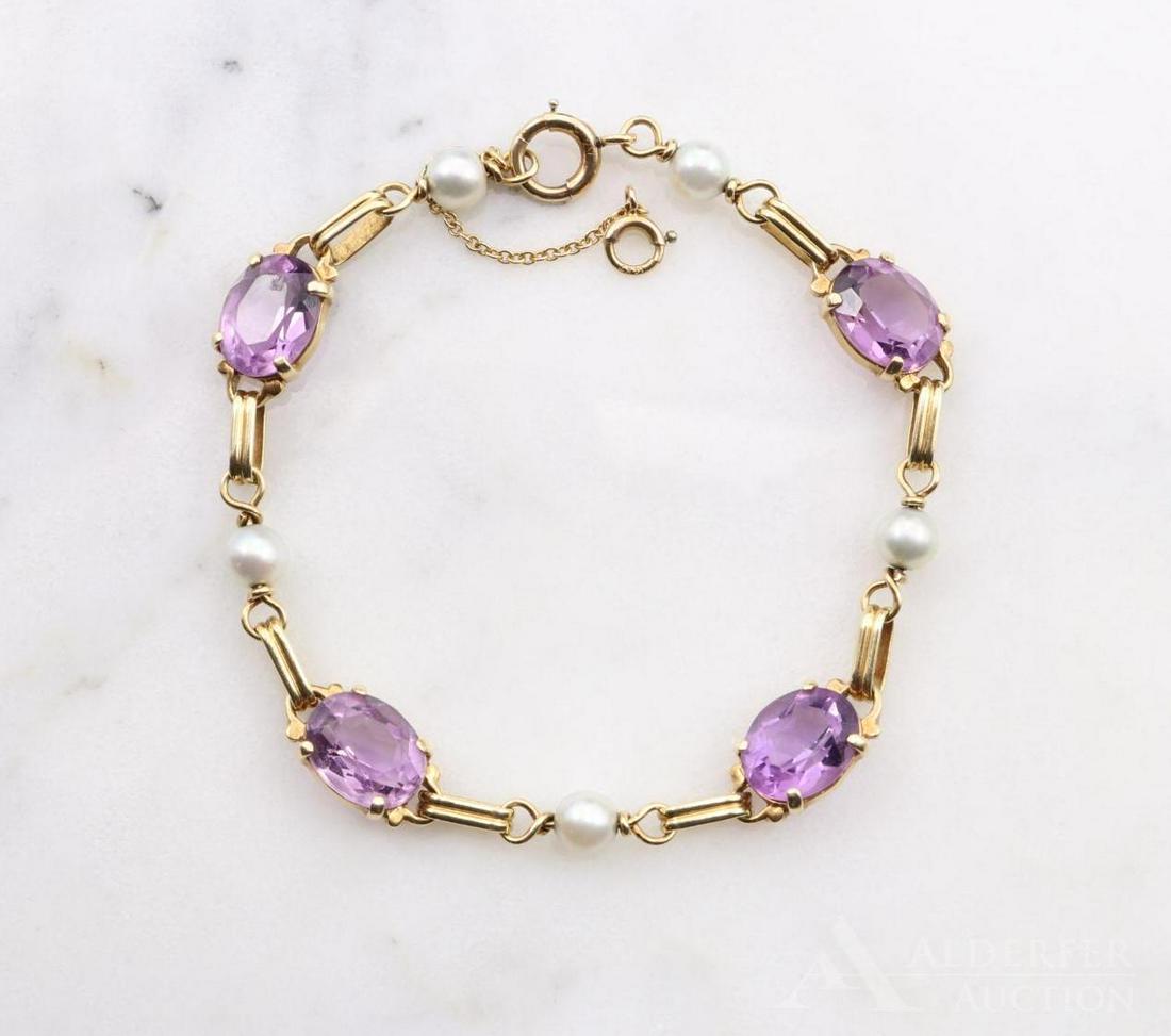 14KY Gold Amethyst and Pearl Bracelet: Features (3) 10 x 8mm oval Amethyst and (4) 5.0mm round Pearls. 7" long with safety chain. 8.7gtw.