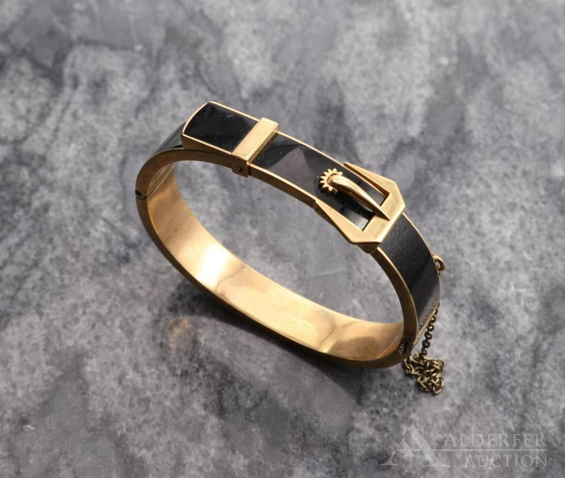 10K Rose Gold Black Enamel Victorian Bracelet: Hinged bangle with safety chain features a belt with buckle design. 15.2mm wide at buckle. 2 x 1 5/8" I.D. 20.5gtw.