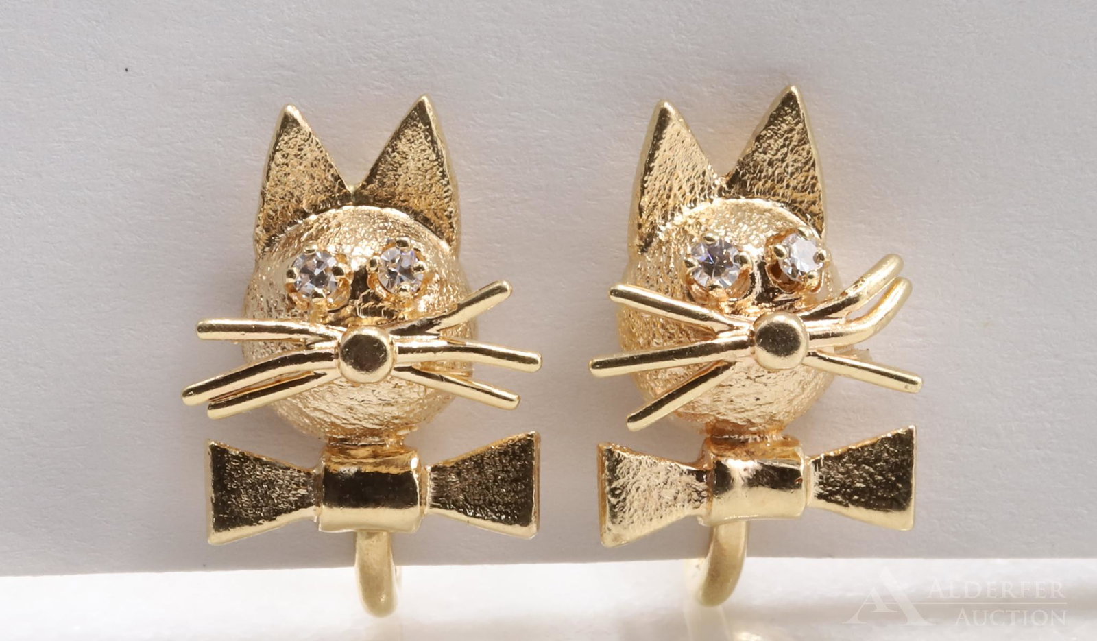B.A. Ballou 14KY Gold Novelty Cat Earrings: Each screw back non piereced earring features a cat with round Diamond eyes, wearing a bowtie. Marked CINI. 3/4". 3.3dwt, 5.3gtw.