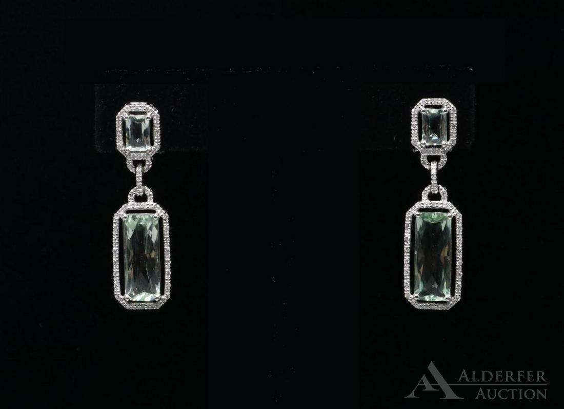14KW Gold Prasiolite and Diamond Earrings: Each omega back post earring features (1) 15 x 6mm and (1) 6 x 4mm checkerboard top rectangular Prasiolite haloed by multiple tiny round Diamonds alternating with gold in an illusion setting. 1 1/2" 