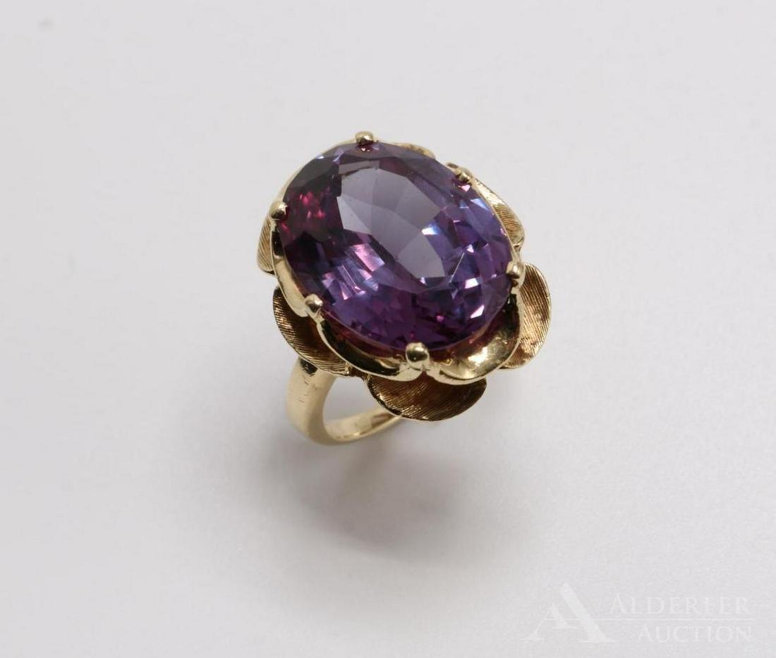 10KY Gold Synthetic Alexandrite Ring: Features (1) 16 x 12mm oval. Size 4 3/4. 7.3gtw.