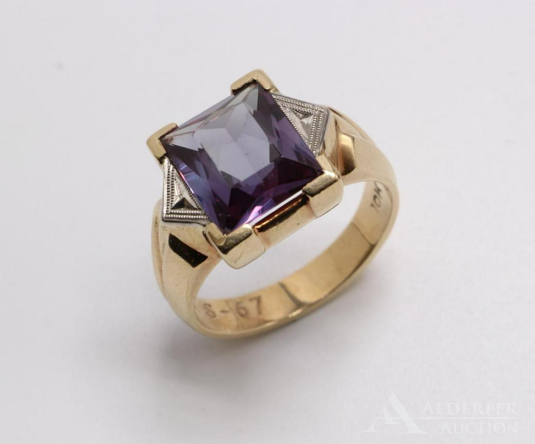 10KY Gold Synthetic Alexandrite Ring: Features (1) 12 x 10mm radiant cut stone flanked by white gold detailing. Size 10 1/2. RHS-67 engraved inside shank. 8.0gtw.