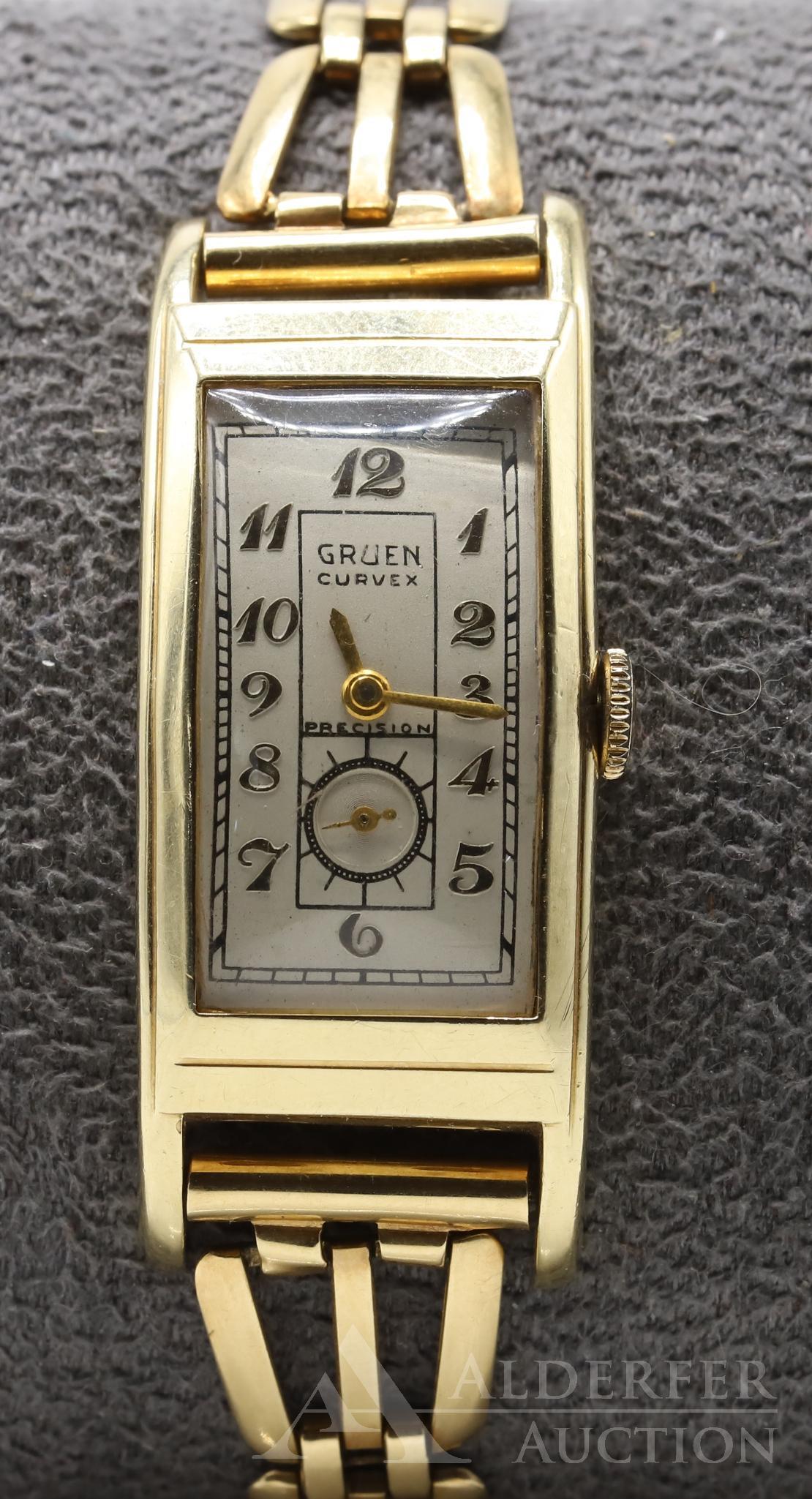 14KY Gold Gruen Curvex Precision Wristwatch: Gold bezel and band. 17 Jewels, Serial #609100. Single sunk. Warped / twisted: case and dial are not aligned properly. Upper right corner of dial is not in line with crystal. Personalized case monogra