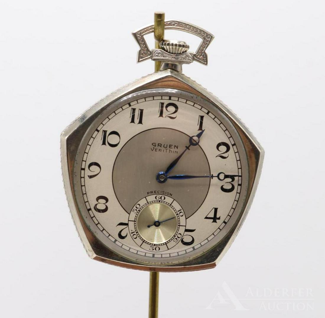 14KW Gold Filled Gruen Verithin Pocket Watch: Precision 45mm open face pentagon. 14KW gold filled reinforced with extra gold. 17 Jewels, Serial #681614. Arabic numerals, blue hands.
