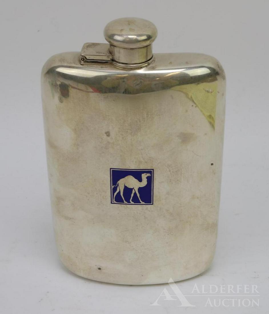 Tiffany & Co. Sterling Silver Flask: Non-monogrammed sterling silver flask with blue enamel camel decoration to the front. 4 Gills. First half of the 20th c. On the proper right side of the flask's shoulder there is a small dent. There i