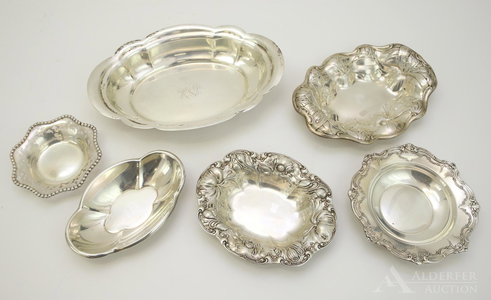 Sterling Silver Tableware: Collection of sterling silver serving dishes and bowls, makers include Wallace, Gorham and Reed and Barton. Largest measures 2"h x 10.75"w x 7.25"d and 27.8ozt
