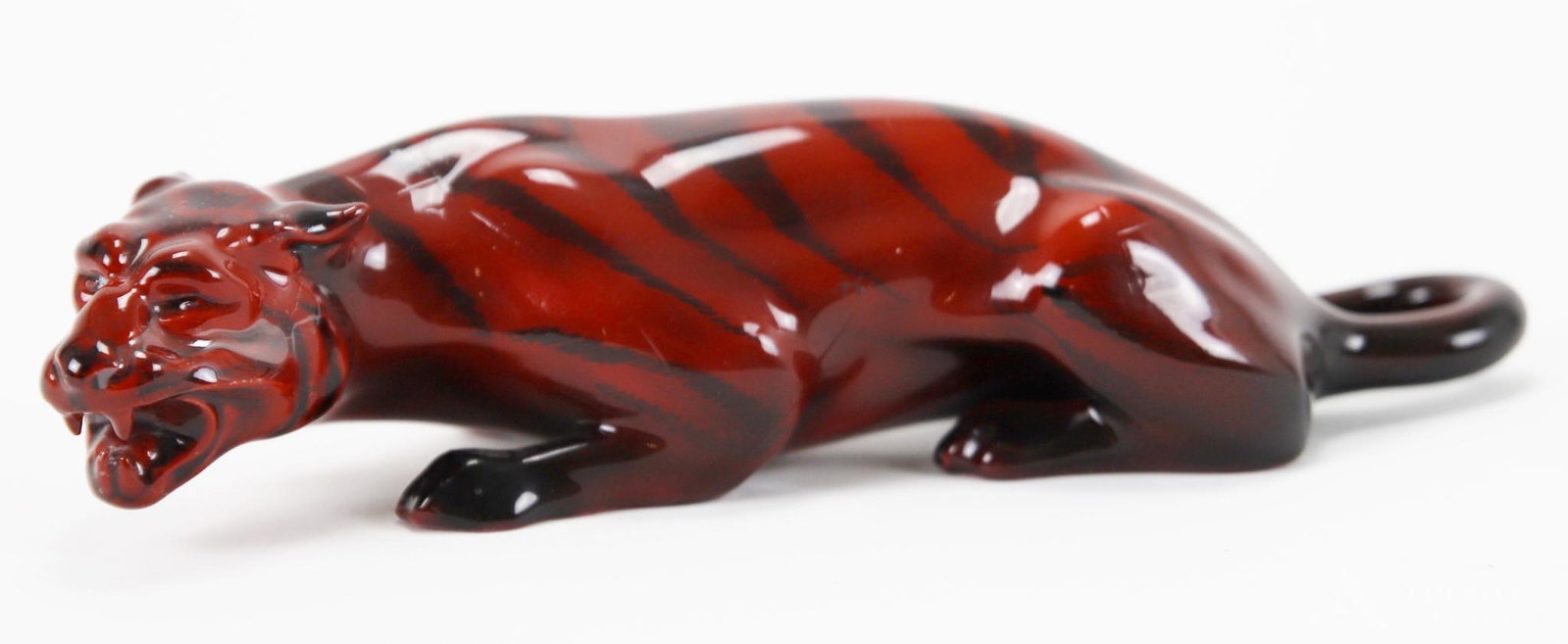 Royal Doulton Flambe Statue: Royal Doulton Flambe statue, HN225, of a crouching tiger. Signed Noke. 2"h x 9.5"l