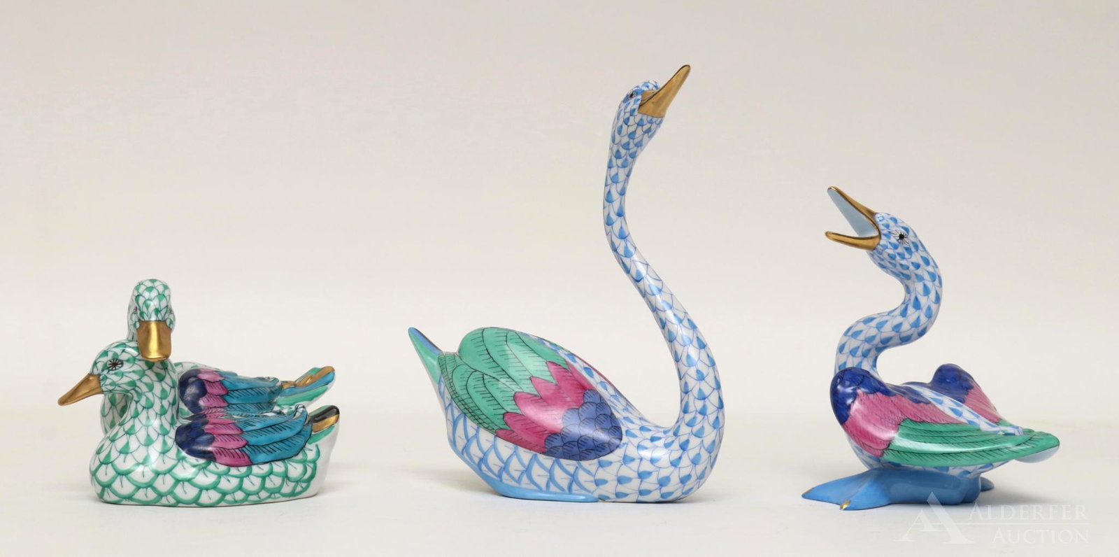 Herend Porcelain Figures: Swan, a pair of ducks and a goose in blue fishnet decoration. Largest measures 5.5"h x 5"long (swan)