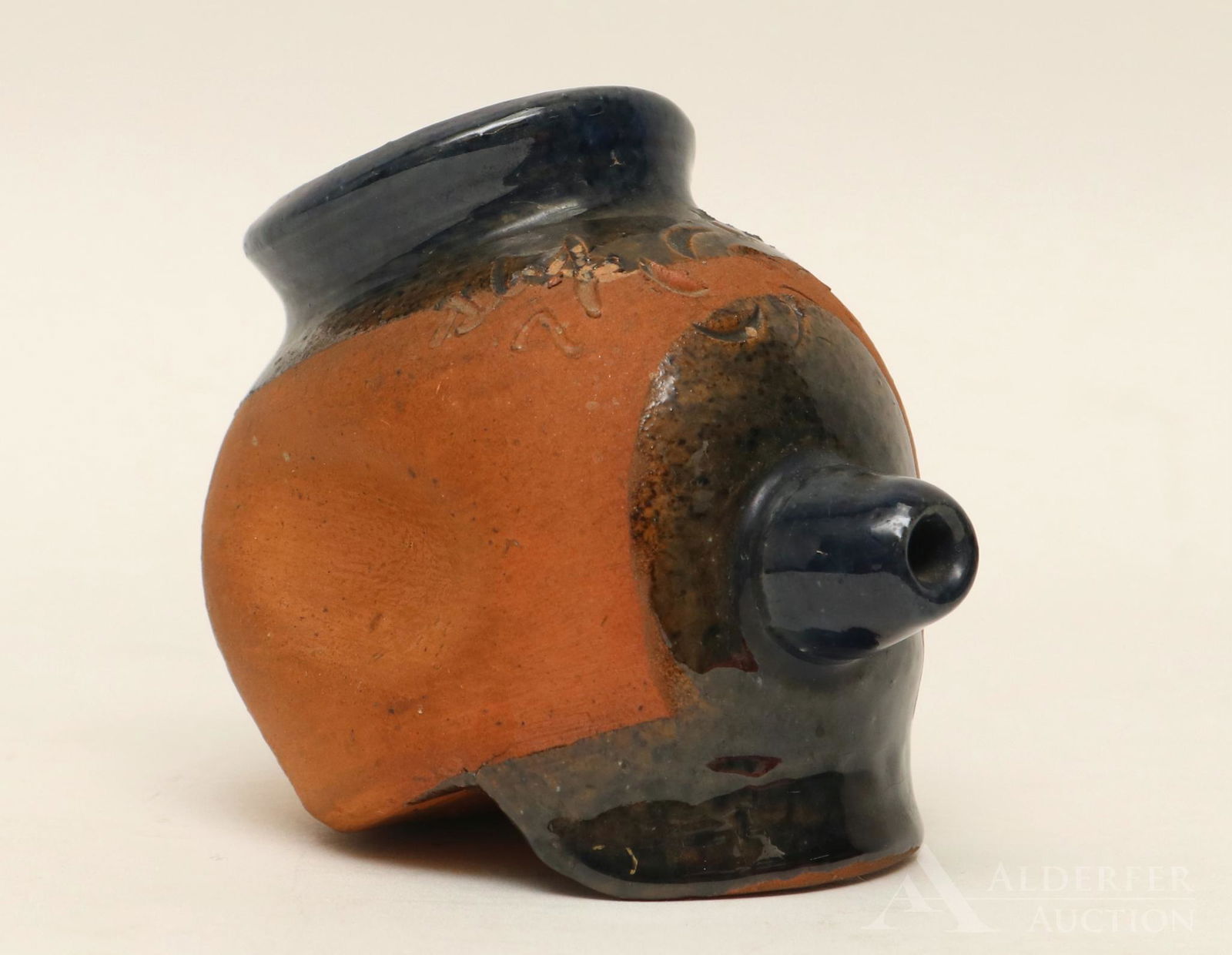 Russell Stahl Redware Pottery Slip Cup: Partially glazed "Slip Cup" decorated with an incised pinwheel and title, signed and dated R. R. Stahl, 1949. 2.5"h x 3.5"w x 2.25"d
