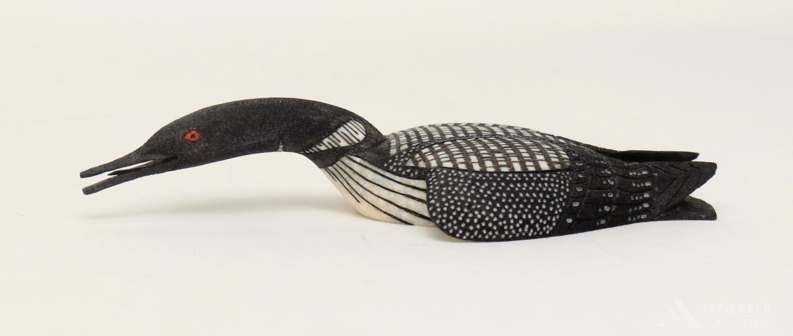 Inuit Scrimshaw Carving: Scrimshaw carving by Ted Mayac Jr. of a common loon, dated 4-25-05. 5.25"w x 2.25"d