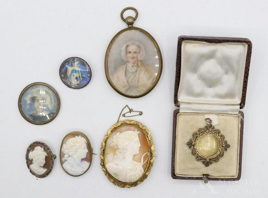 Cameo's and Miniature Portraits: Grouping includes (3) portrait cameos, a butterfly wing pendant, a miniature matriarch portrait and a cased locket. largest 2.25"