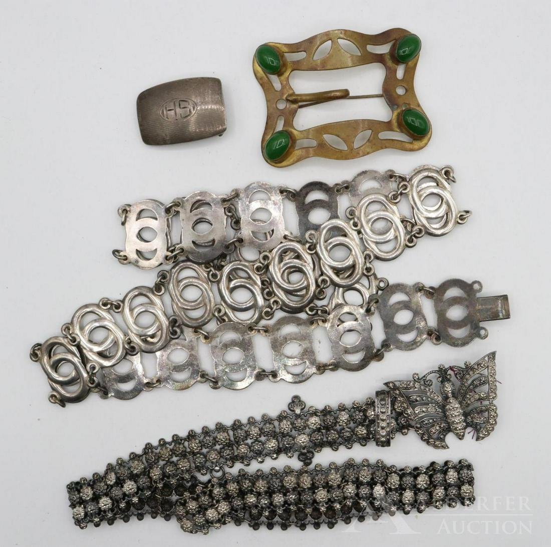 Belts and Buckles: Grouping includes a monogrammed sterling buckle (.5ozt0 and arts and crafts brass buckle with cabochons, an English 22" butterfly motif belt, and a 33" link style belt.