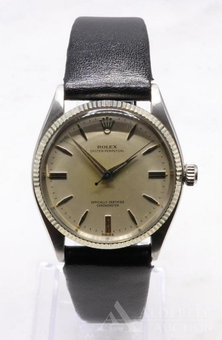 Rolex Oyster Perpetual Wrist Watch: Officially Certified Chronometer. 32.3mm crimped edge bezel. Dial slightly yellowed in center, hands corroded (spotted rough). Currently running but not tested or guaranteed. Black 19 Hirsch Diamond l