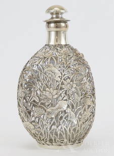 Yuan Shun Chinese Export Decanter: c. 1900, Tianjin, Sterling silver overlay decorated with water lilies, lotus buds and other flora on a Haig's dimpled scotch bottle. Hallmarked Yuan Shun, sterling, bottle marked M803 Haig UGB. 9.25"h