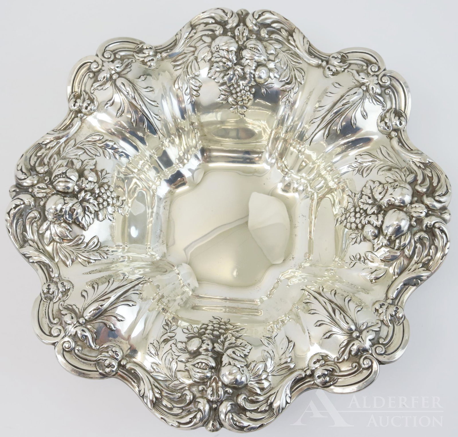 Sterling Silver "Francis I" Bowl: Sterling silver Reed & Barton "Francis I" bowl with baroque style repousse decoration of scrolls and fruit garlands, 23ozt and 3"h x 11.25"round