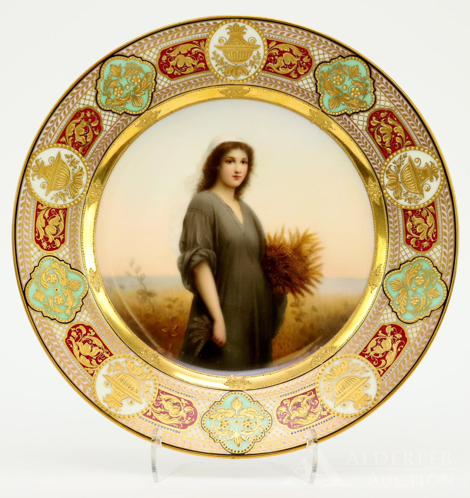 Royal Vienna Portrait Plate: Hand decorated plate with raised gilt decorated border and center with standing portrait of "Ruth" holding a sheaf of wheat, signed "Wagner". 9.5" round