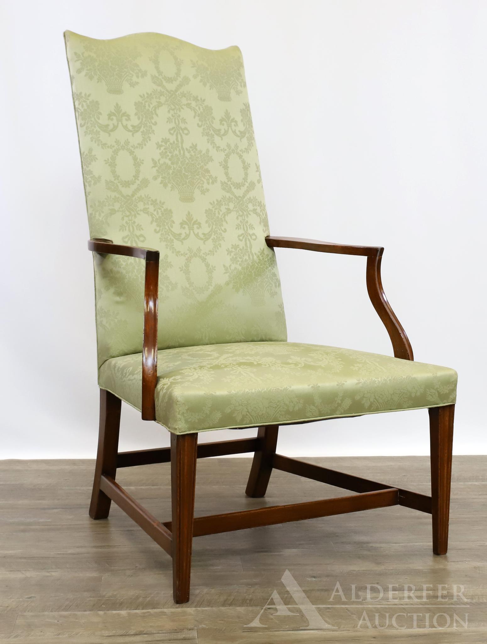 Mahogany Lolling Chair: Serpentine top rail, shaped arms, on molded tapered front and swept back legs, upholstered in green damask fabric. 45"h x 26.5"w x 24"d