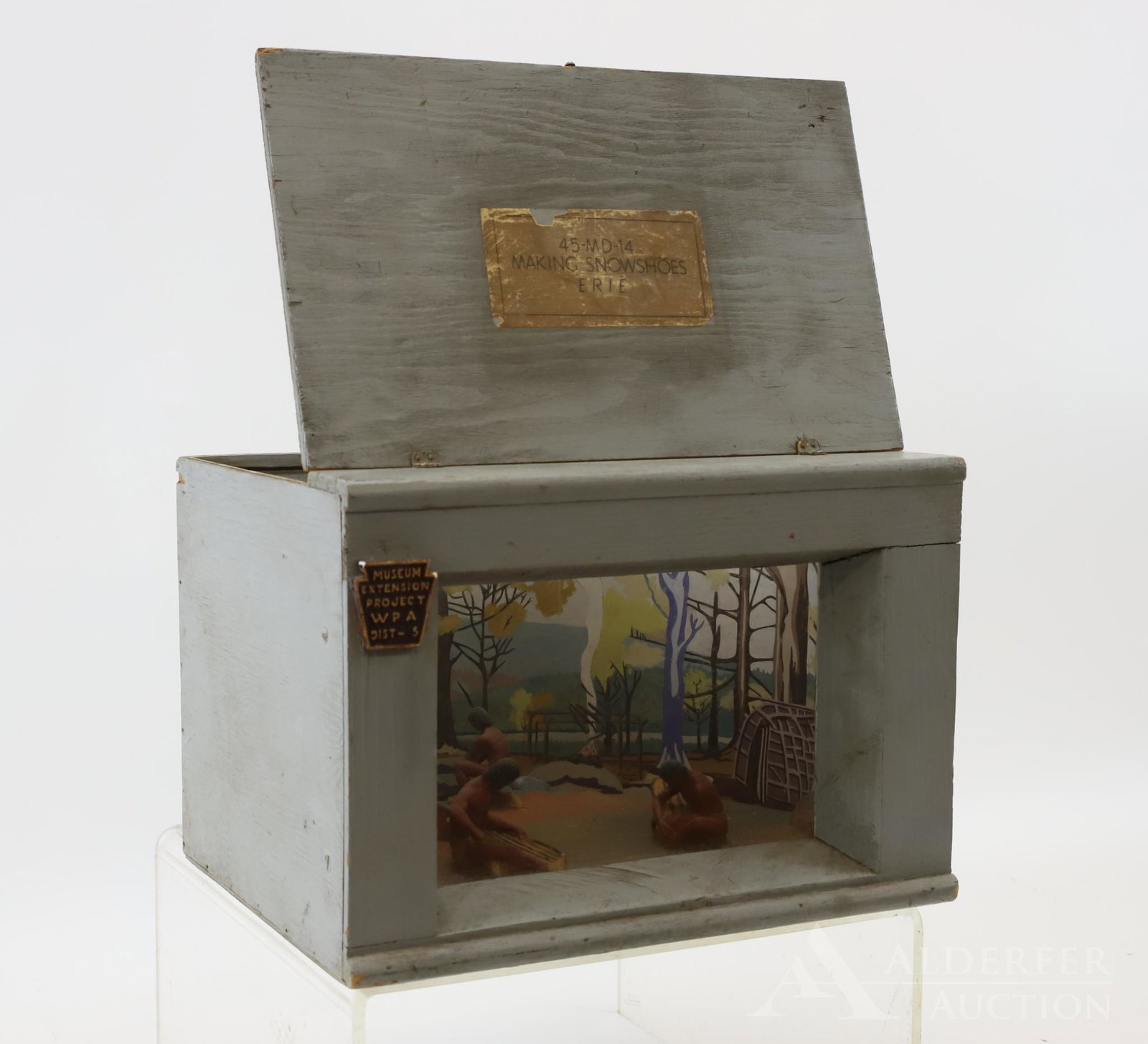WPA Museum Extension Project: A diorama from the "Museum Extension Project - WPA, District 5", labeled " 45-MD-14 Making Snowshoes Erie" features a pair of Native American's crafting snowshoes with a third in the distance. 8.75"
