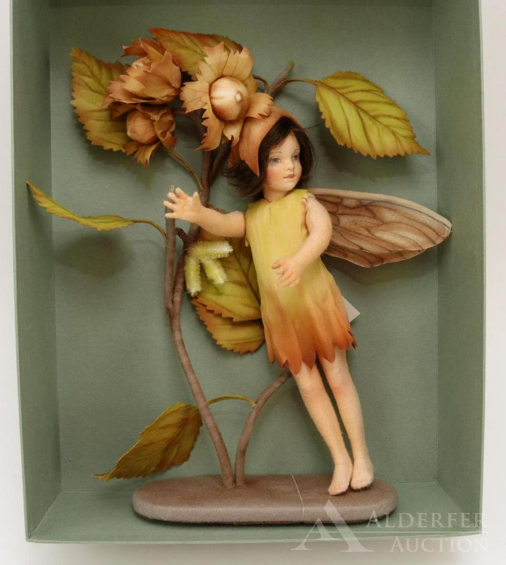 R. JOHN WRIGHT LOT.: MIB 9 1/2" 2010 "The Hazel-Nut Fairy". No 27/250. Part of The Flower Fairies Series. Condition: box has age discoloration.
