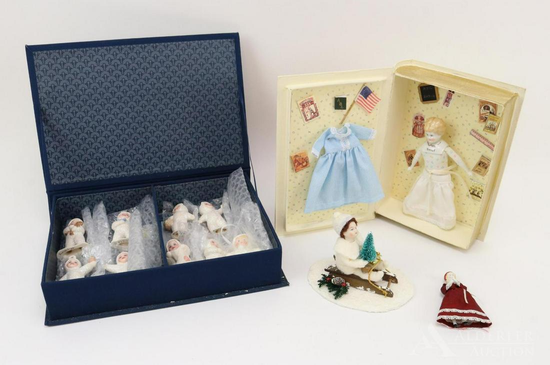 LOT OF HOLIDAY/NOVELTY.: Lot of (8) 3 1/2" 2006 porcelain snow figures/ornaments by artist Joan Benzell (former UFDC Region 13 Director). Also included is a 3" papier mache figure. (3) Items made by artist Rosemarie Snyder. C