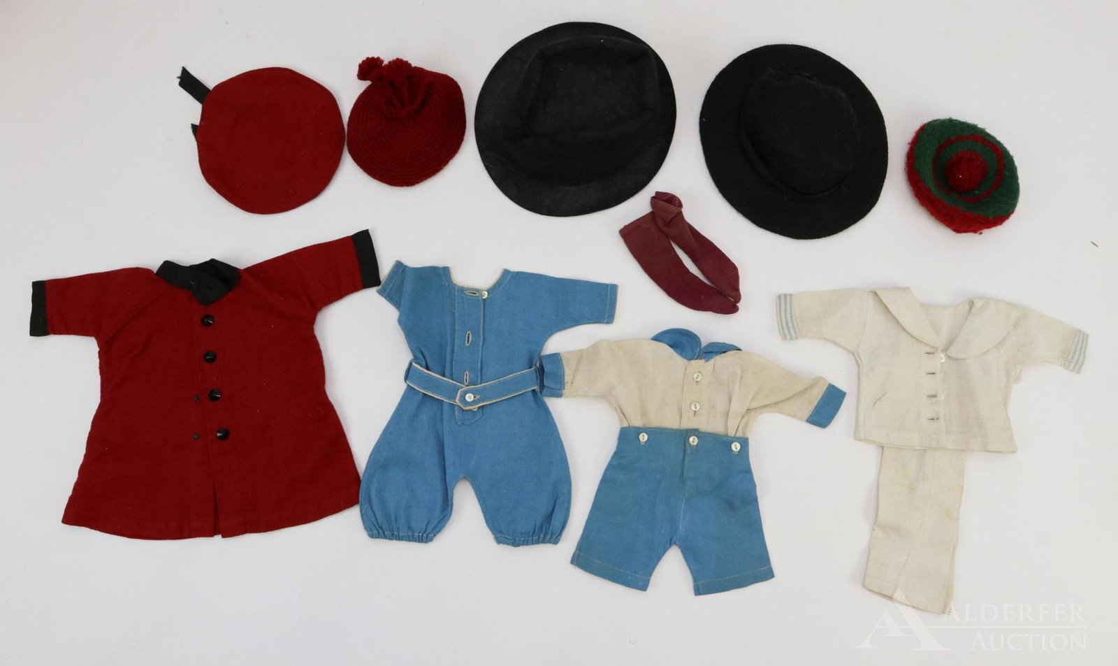 LOT OF ANTIQUE/VINTAGE CLOTHING.: Lot of antique/vintage doll clothing. Lot of (3) black felt hats for male dolls. Pair of wook knit hats. Clothes - 2 pc. white sailor suit. Blue/white 2 pc. romper. 1 Pc. blue romper. Red wool coat, h